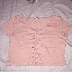 A Chartlotte Russe lace up front shirt.